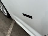 a close up of a car door with a sticker on it