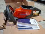 a chainsaw that is sitting on top of a cardboard box