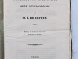 an open book on a white table with a black and white title