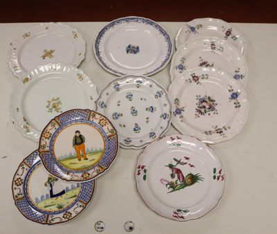 many plates with different designs on them on a table