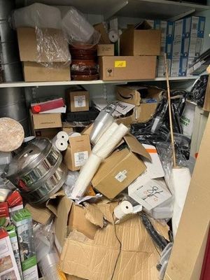 a large amount of boxes and other items in the closet