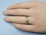a close up of a person ' s hand with a ring on it