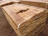 several stacks of wooden planks stacked on top of each other