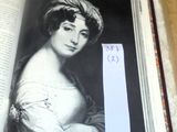 an open book with a picture of a woman holding a bookmark