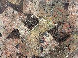 une image représentant un gros plan d'un tableau sur lequel on voit des éclaboussures de peinture