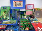 a lot of different items in a box on the table