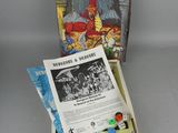 the box is open with a game in it and a card in it
