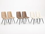un ensemble de quatre chaises aux pieds noirs et aux assises rembourrées beiges