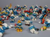 toy figurines of smurfs are arranged in a circle
