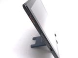 a close up of a cell phone on a stand