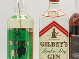 three bottles of gin, a bottle of gin and a bottle of gin