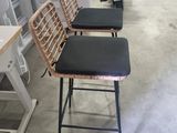 three chairs that are sitting in the middle of a room
