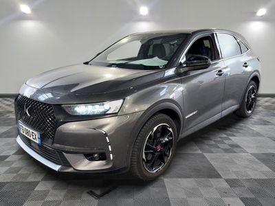 a grey 2020 dsx is parked in a room with a checkered floor
