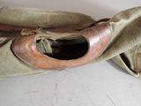 a pair of shoes that are sitting on a bag