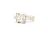 an image of a princess cut diamond ring with baguets