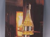 a picture of a picture of a bottle of wine on a table