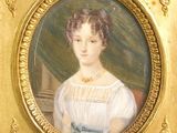 portrait of a woman in a white dress in a gold frame