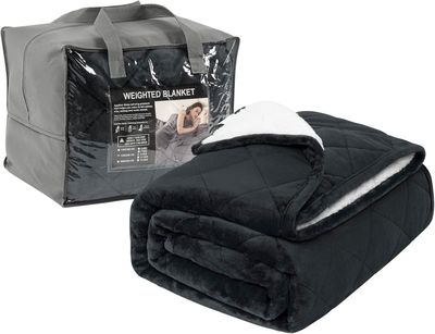a close up of a blanket and a bag on a white background