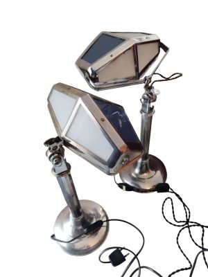 a picture of a desk lamp with a cell phone attached to it