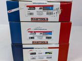 three boxes of mailboxs stacked on top of each other on a white surface
