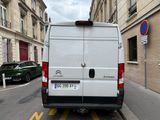 a white van that is parked on the side of the street