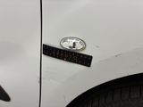 a close up of a car door with a sticker on it