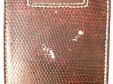 a close up of a brown leather wallet on a white background