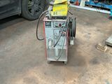 a machine that is sitting on the ground in a garage