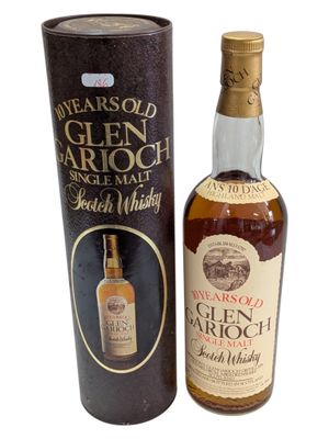 an image of a bottle of old scotch whisky next to a cardboard box