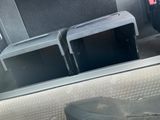 two microwaves sitting in the back of a car