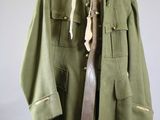 an image of a military jacket with a knife on it