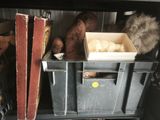 two bins that are filled with stuff in a room