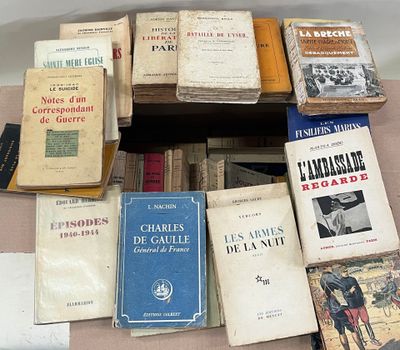 several books are stacked on top of each other on a table