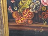 a picture of a painting of flowers in a gold frame