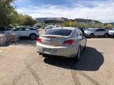cars parked in a parking lot in front of a building