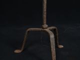 a close up of a metal stand with a clock on top of it