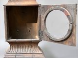 a small wooden box with a mirror inside of it