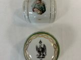 a small glass container with a picture of a man on it