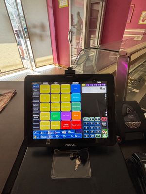 a tablet computer sitting on top of a black table