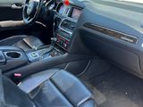 the interior of a car with black leather seats and steering controls