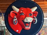 a picture of a red bull head on a blue plate
