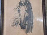 painting of a horse in a frame on a wall