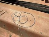 graffiti on the side of a truck with a chain around it