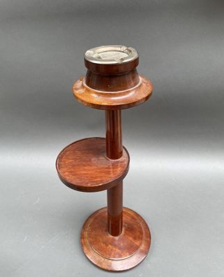 a small wooden table with two shelves on it