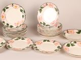 a lot of plates that are sitting on a table