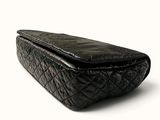 an image of a black purse on a white background