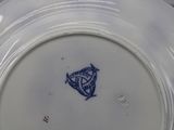 a white plate with a blue design on it