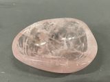 a pink quartz stone sitting on top of a table