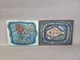two paintings of a fish and a fish on the wall