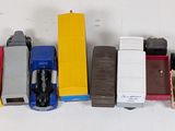 many different types of toy trucks lined up on a table